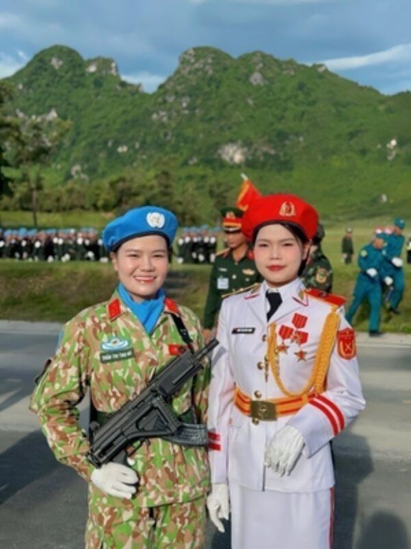 80th National Day: Two sisters march in parade formation