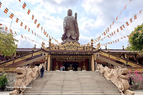 Towering Buddha statue at a pagoda in An Giang province
