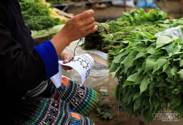 Hmong women keep traditional craft alive through spinning, weaving and embroidery